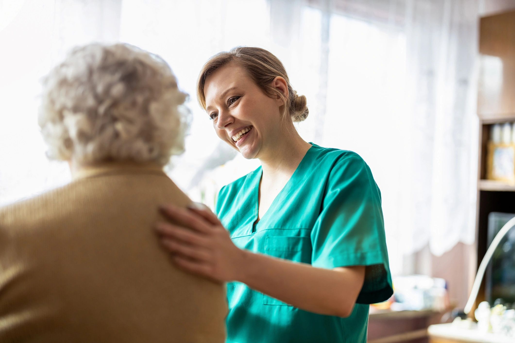 caregiver helping elderly client