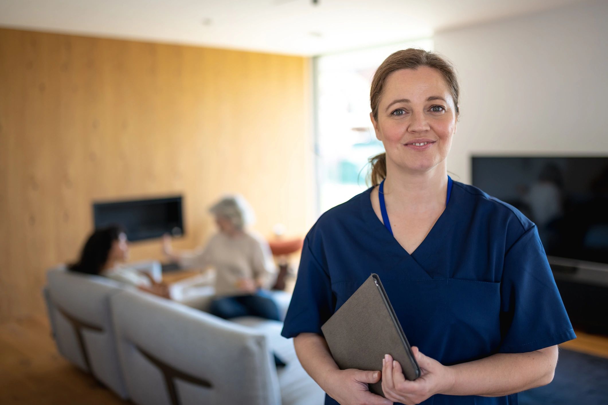 diverse home health care staff with seniors