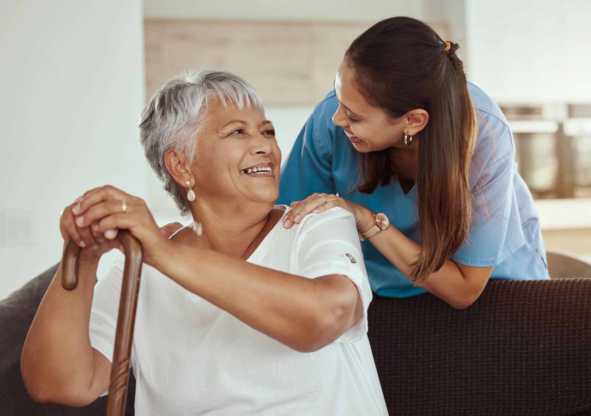 diverse home health care staff with seniors