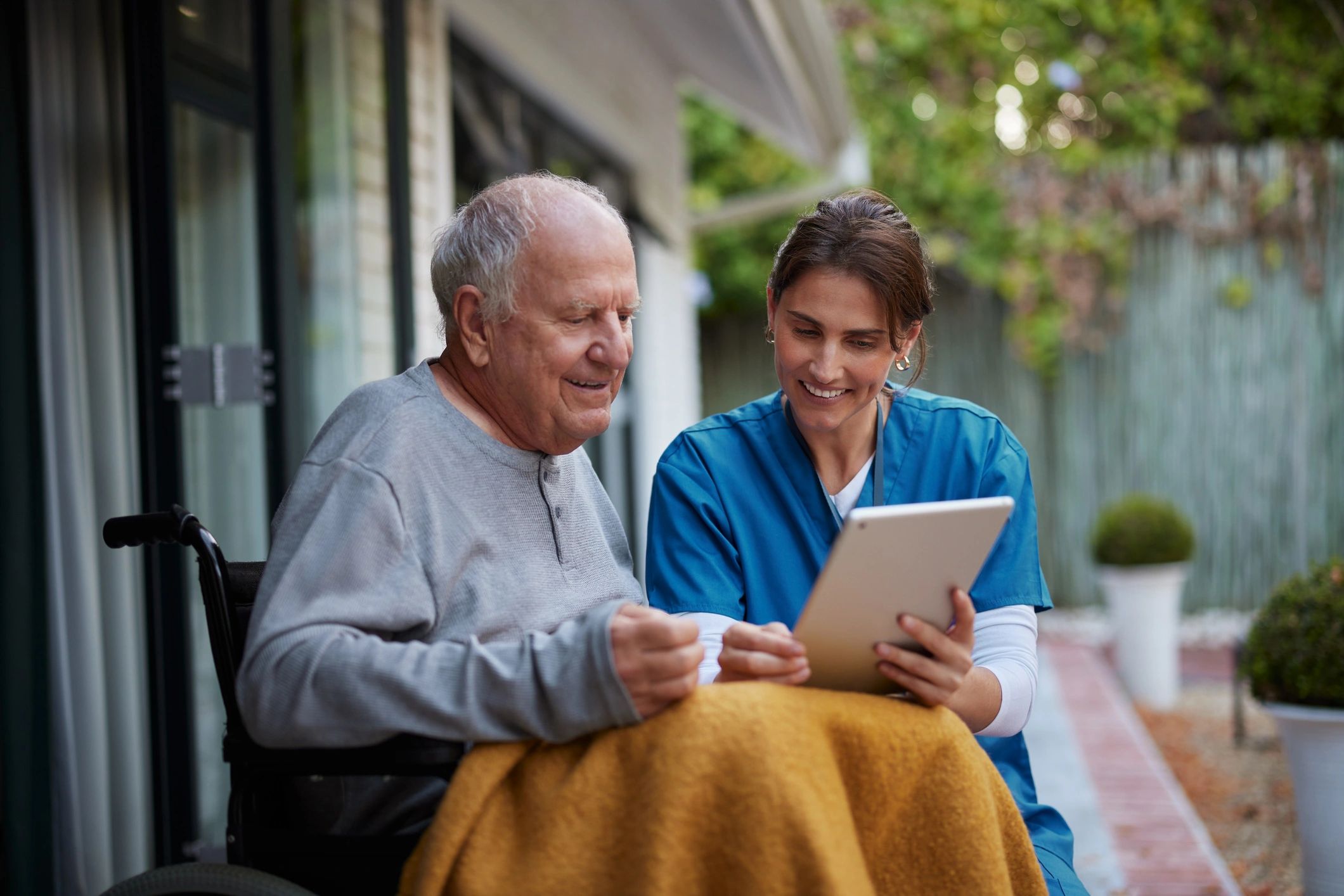 friendly healthcare professional with elderly patient