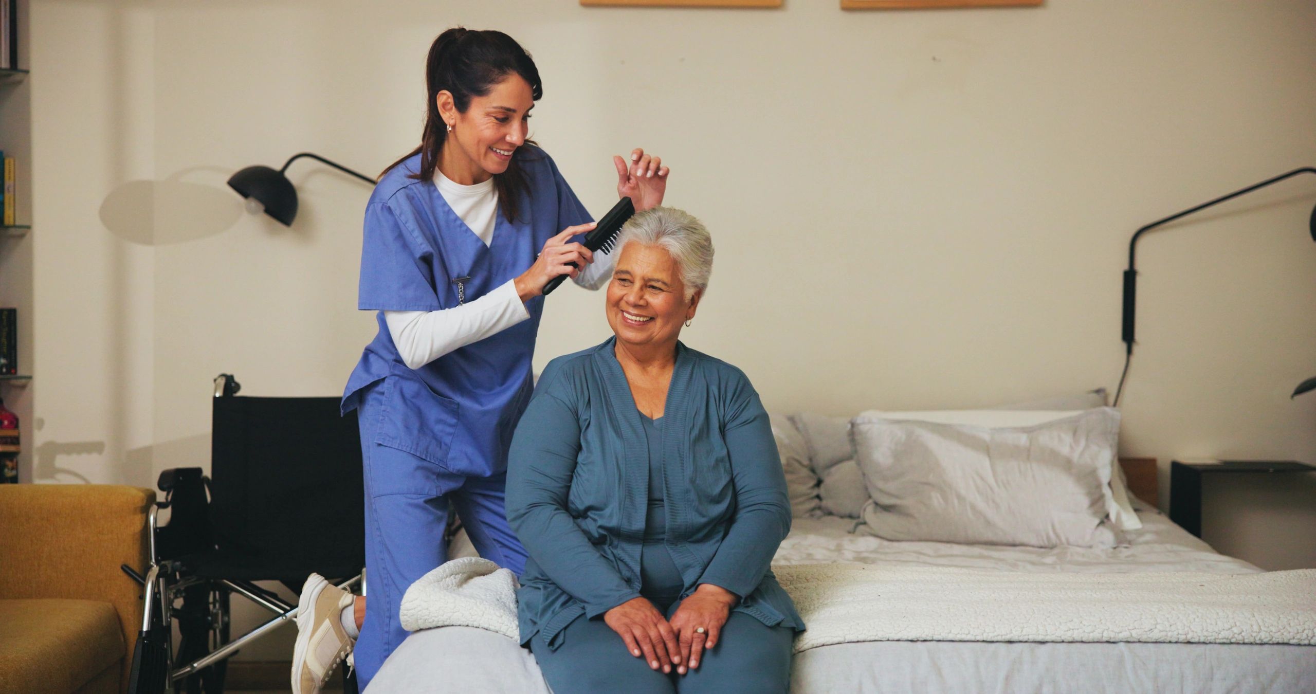 caregiver helping elderly at home