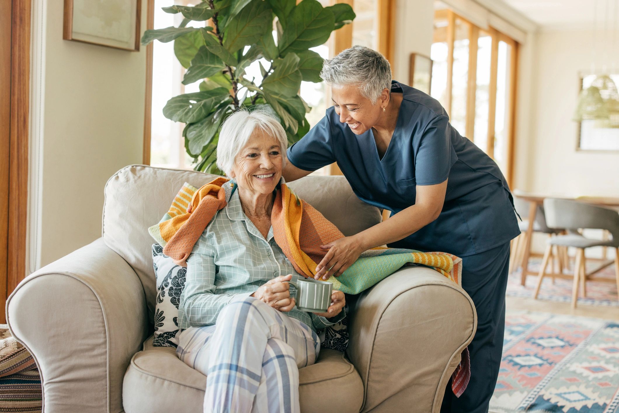 friendly healthcare professional with elderly patient