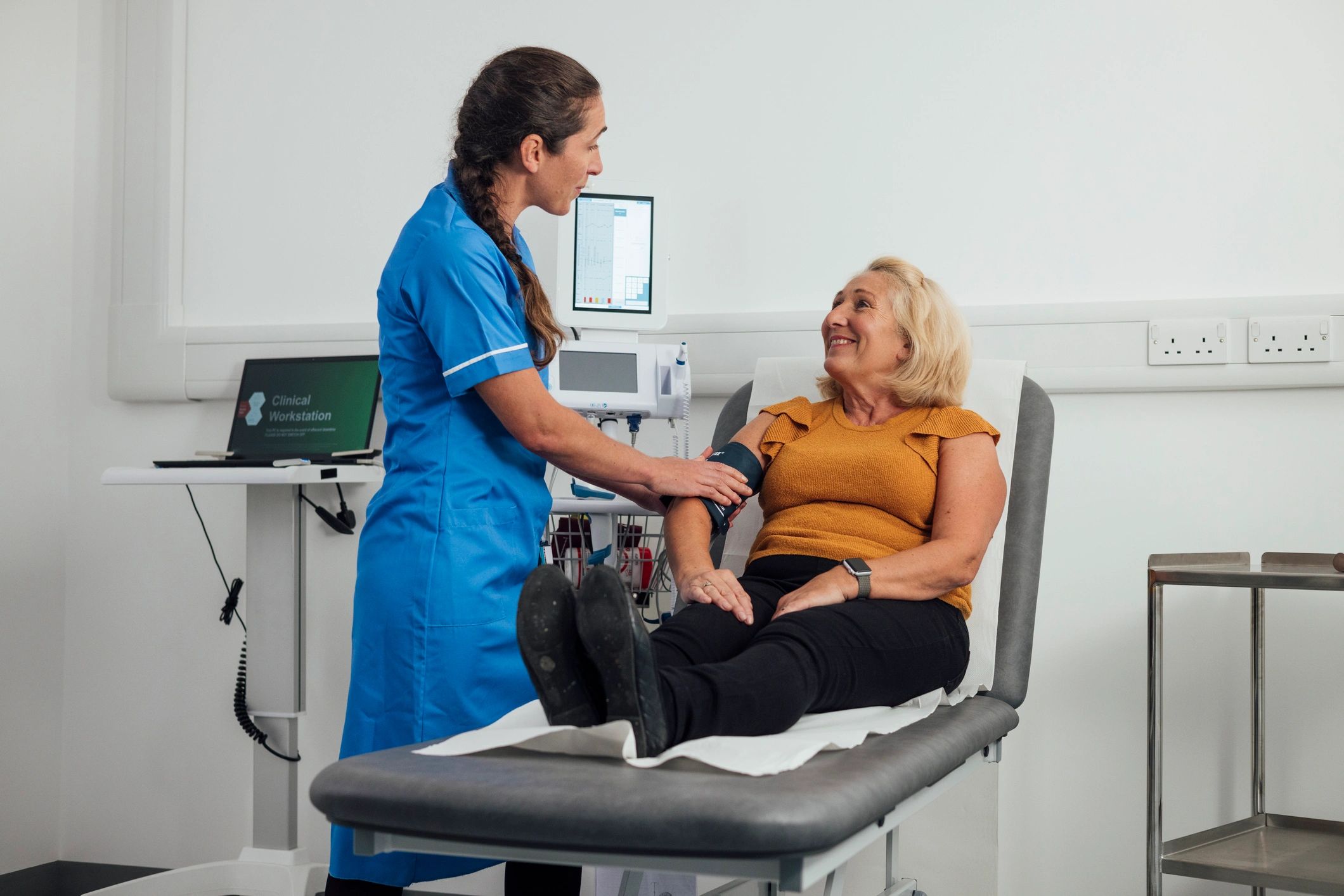 Healthcare professional supporting a patient during a care visit